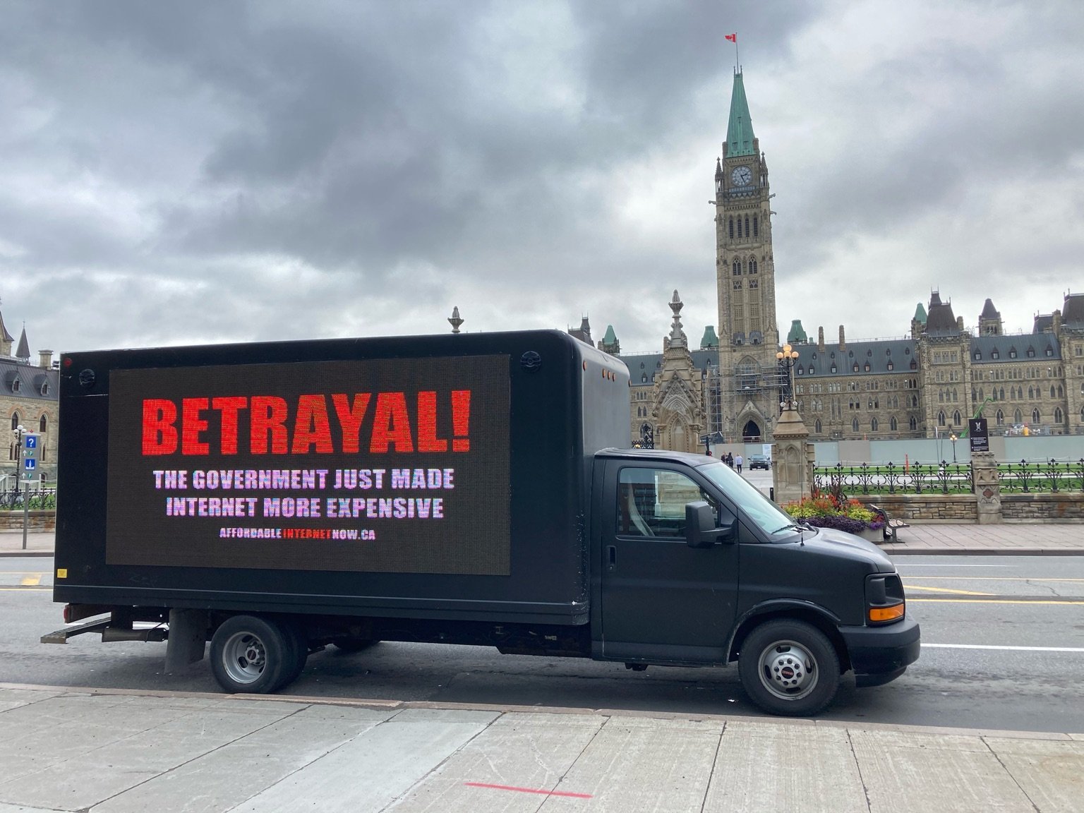 Truck with billboard: Betrayal! The government just made internet more expensive